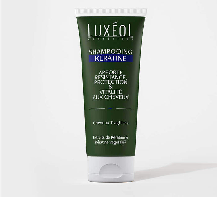 Luxéol šampūnas su keratinu 200 ml tūbelė minimaliame fone trapiems plaukams stiprumui ir gyvybingumui.